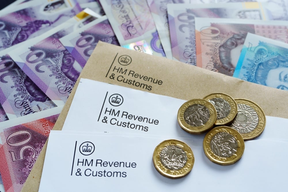 HMRC tax enquiry letters with pound coins and notes